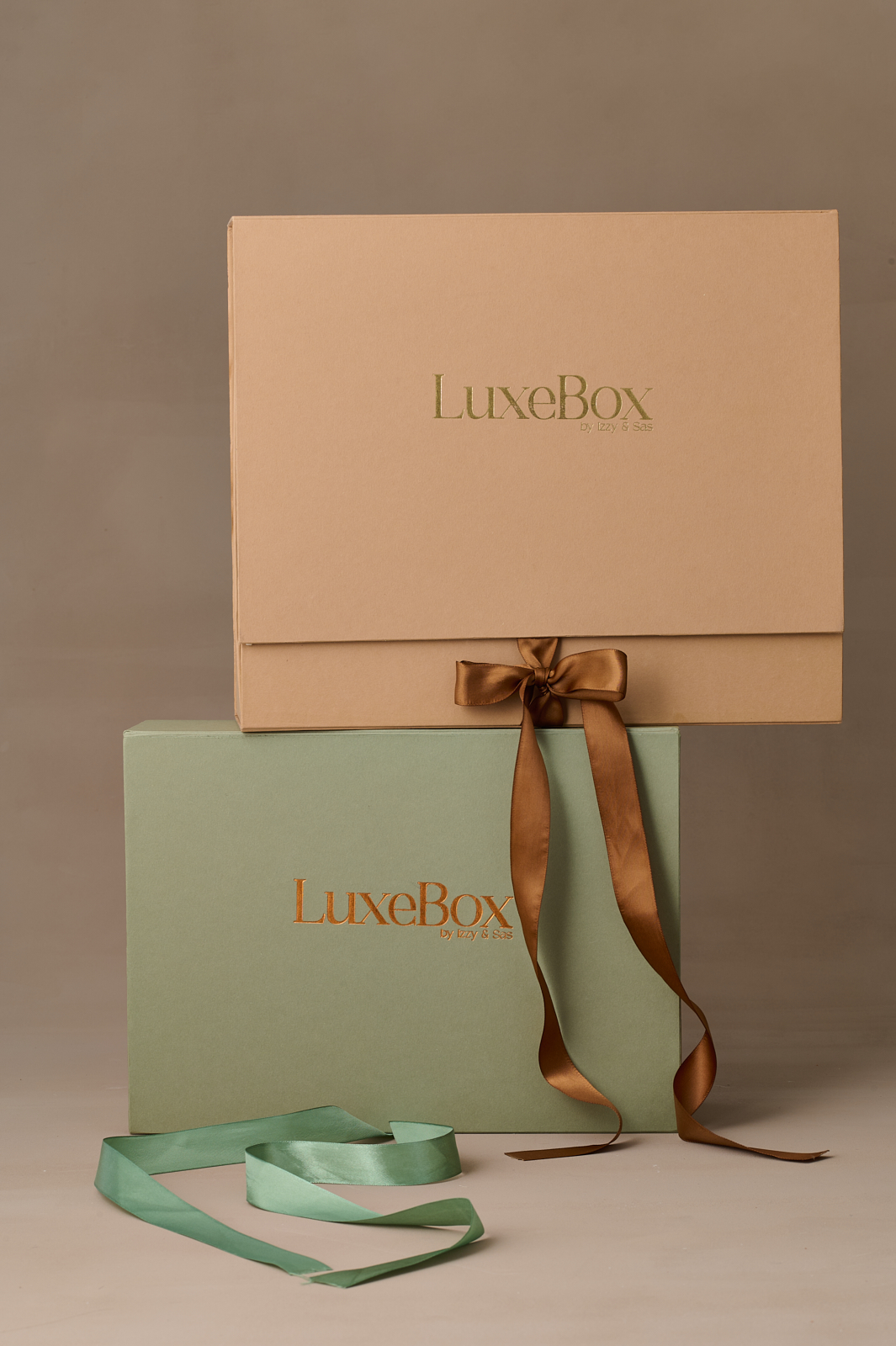 Earthy colours corporate gift boxes stacked on each other.